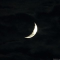 Crescent Moon In Clouds